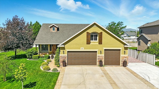 7414 S Regal Dr, West Jordan, UT 84081 - view of front of property with stone siding, driveway, stucco siding, and roof with shingles