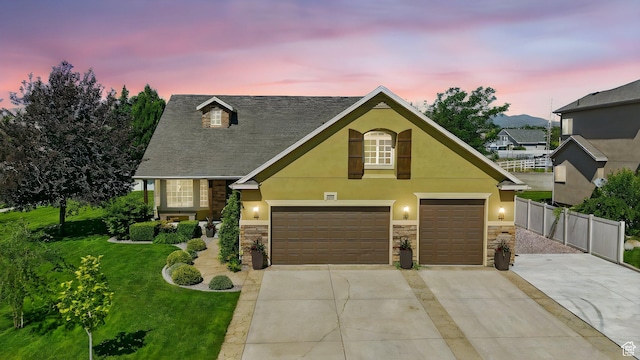 7414 S Regal Dr, West Jordan, UT 84081 - traditional-style house with stone siding, driveway, and stucco siding