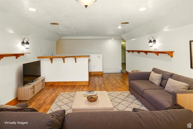 7414 S Regal Dr, West Jordan, UT 84081 - living area featuring a textured ceiling, wood finished floors, recessed lighting, and vaulted ceiling