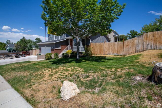 1211 E Spring Ridge Dr S, Sandy, UT 84094 - view of front facade featuring brick siding and a garage