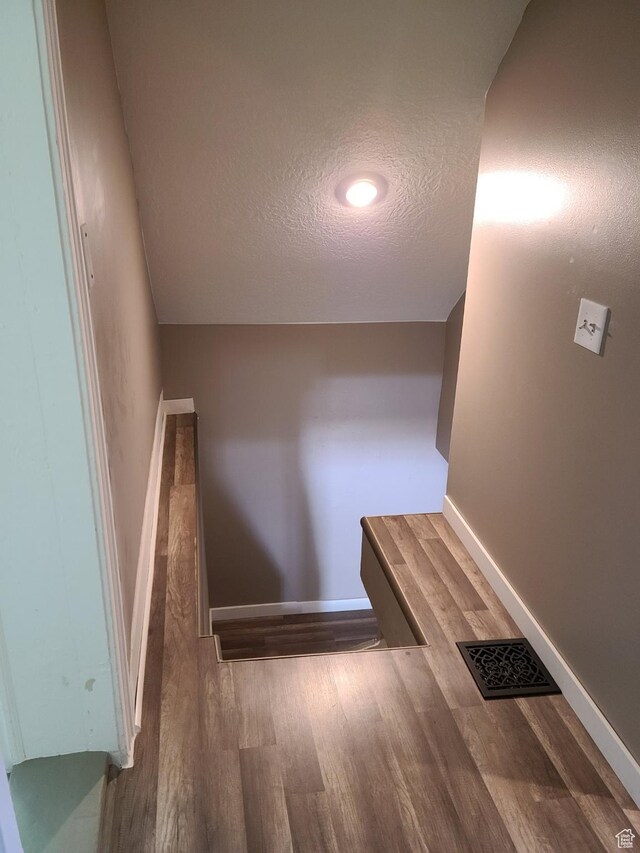 48 N Main St, Ephraim, UT 84627 - staircase featuring a textured ceiling and wood finished floors