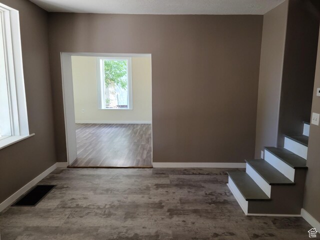 48 N Main St, Ephraim, UT 84627 - unfurnished room featuring wood finished floors and stairway