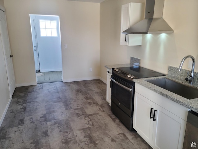 48 N Main St, Ephraim, UT 84627 - kitchen with wall chimney range hood, electric range, white cabinets, and light stone counters