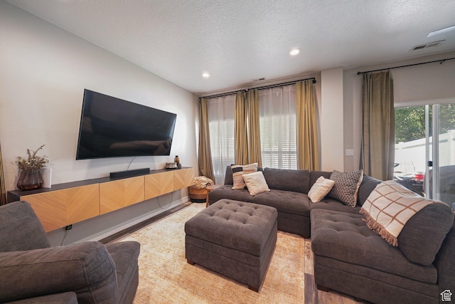 211 Greenfield Cir Unit 119, Heber City, UT 84032 - living room featuring a textured ceiling and recessed lighting