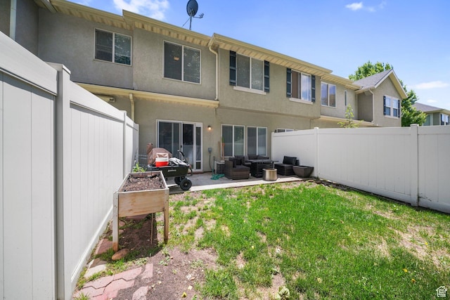 211 Greenfield Cir Unit 119, Heber City, UT 84032 - back of property featuring outdoor lounge area, a fenced backyard, a patio, and stucco siding