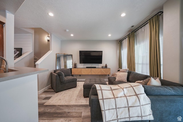 211 Greenfield Cir Unit 119, Heber City, UT 84032 - living area with wood finished floors, recessed lighting, a textured ceiling, and stairway