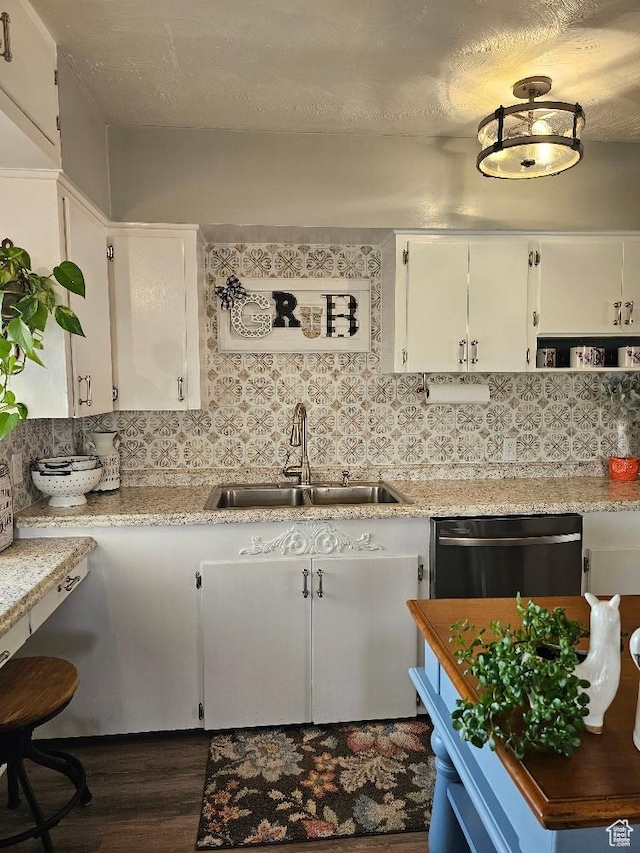 675 W 3300 N, Vernal, UT 84078 - kitchen featuring stainless steel dishwasher, dark wood finished floors, backsplash, and white cabinets