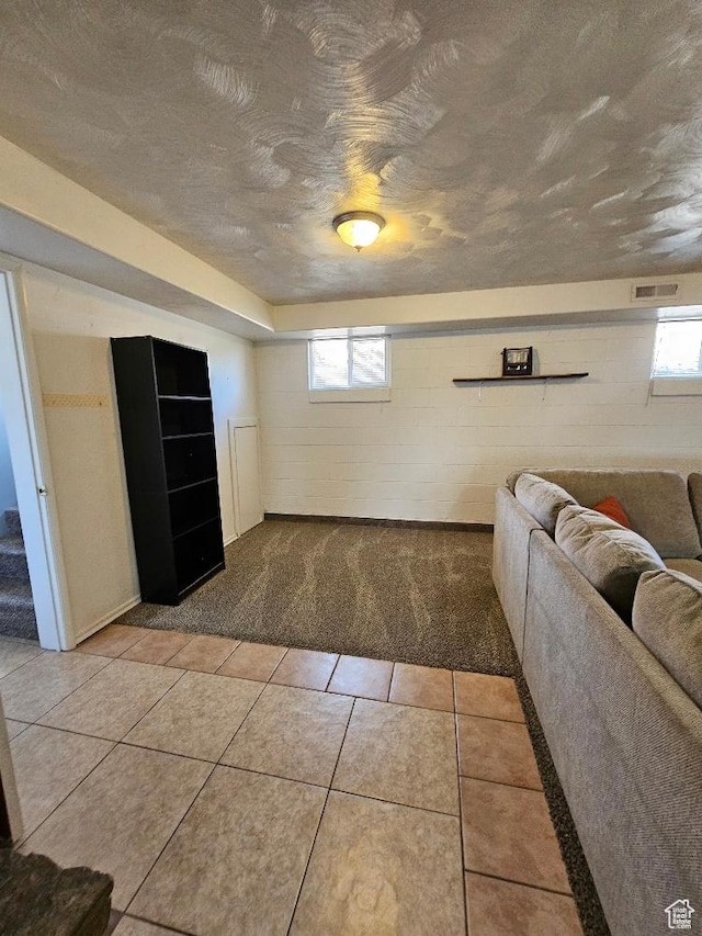 675 W 3300 N, Vernal, UT 84078 - living room featuring a textured ceiling, light colored carpet, healthy amount of natural light, and light tile patterned flooring