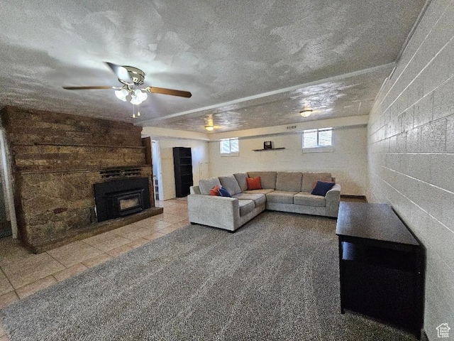 675 W 3300 N, Vernal, UT 84078 - tiled living area with concrete block wall, a textured ceiling, a ceiling fan, and a fireplace