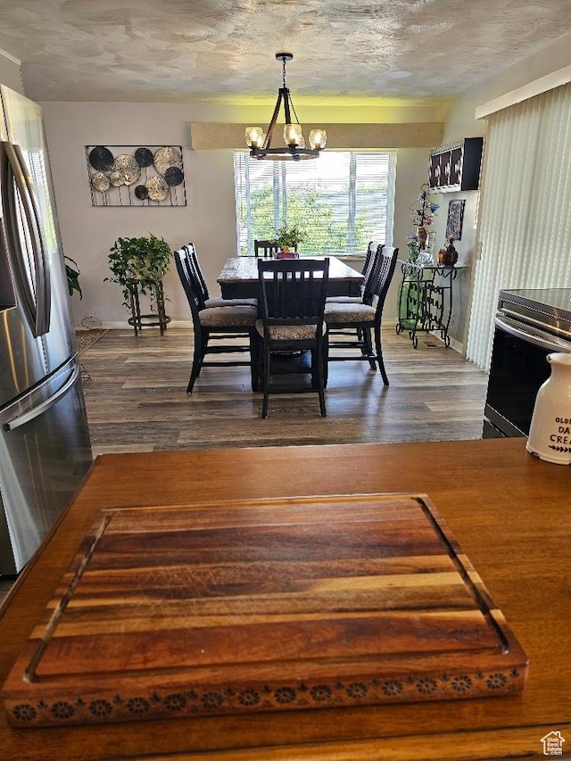 675 W 3300 N, Vernal, UT 84078 - dining space featuring dark wood finished floors and a chandelier