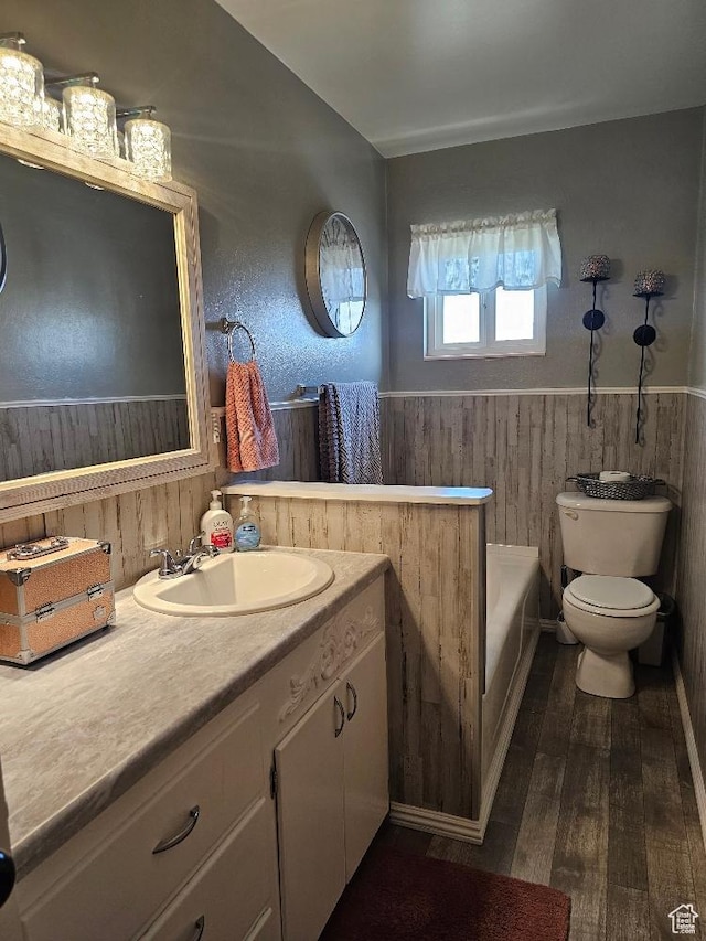675 W 3300 N, Vernal, UT 84078 - bathroom with a wainscoted wall, wood-type flooring, a bathtub, vanity, and wooden walls