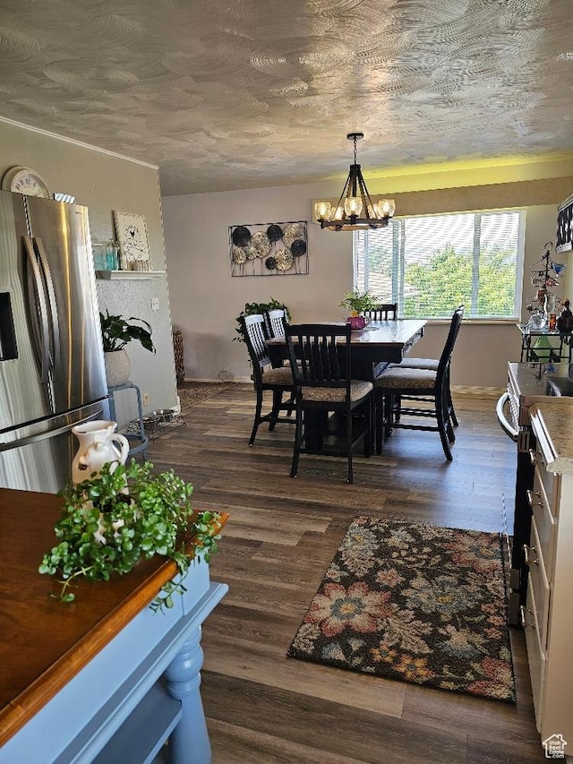675 W 3300 N, Vernal, UT 84078 - dining room with a chandelier and dark wood-style floors