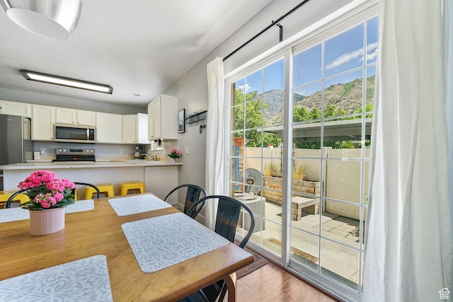 1332 S 1400 E, Provo, UT 84606 - dining area featuring light wood finished floors and a mountain view