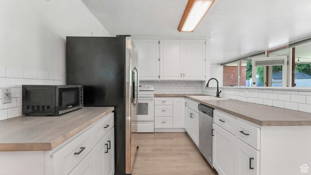 720 N 1200 E, Provo, UT 84606 - kitchen with stainless steel appliances, decorative backsplash, and white cabinets