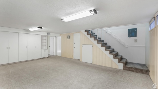 720 N 1200 E, Provo, UT 84606 - finished below grade area featuring a textured ceiling, stairway, carpet, and electric panel