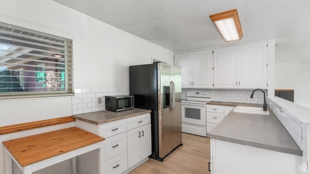 720 N 1200 E, Provo, UT 84606 - kitchen featuring electric stove, black microwave, light wood-type flooring, backsplash, and stainless steel fridge