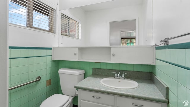 720 N 1200 E, Provo, UT 84606 - bathroom with tile walls, plenty of natural light, vanity, and wainscoting