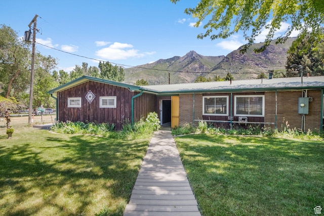 222 S 800 E, Alpine, UT 84004 - view of front of home featuring a mountain view, a front yard, and brick siding