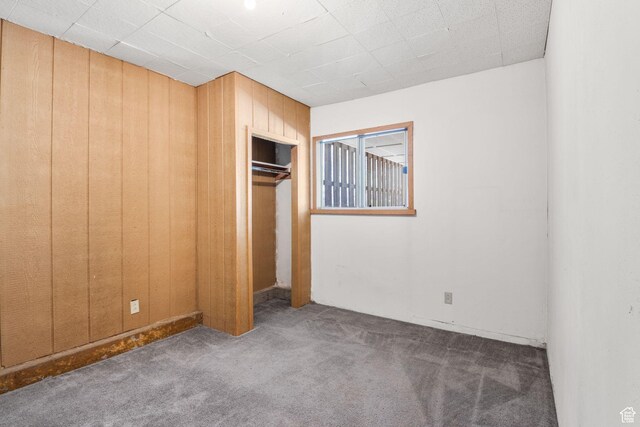 222 S 800 E, Alpine, UT 84004 - unfurnished bedroom featuring carpet floors, wooden walls, and a closet