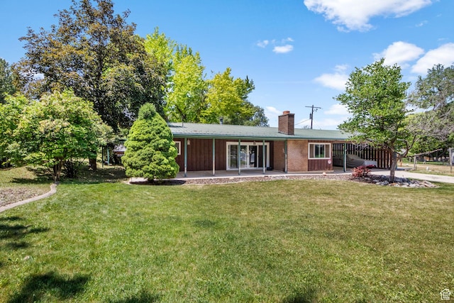 222 S 800 E, Alpine, UT 84004 - back of property featuring a patio area, a chimney, and a lawn