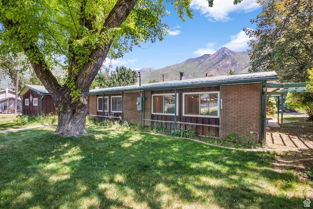 222 S 800 E, Alpine, UT 84004 - ranch-style home with brick siding, a mountain view, and a front yard