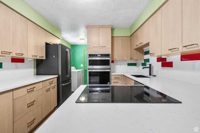 222 S 800 E, Alpine, UT 84004 - kitchen with light brown cabinets, independent washer and dryer, appliances with stainless steel finishes, a textured ceiling, and tasteful backsplash
