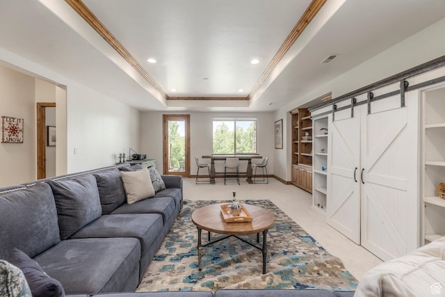 1085 W Links Dr, Midway, UT 84049 - living room featuring a barn door, light carpet, a tray ceiling, recessed lighting, and crown molding