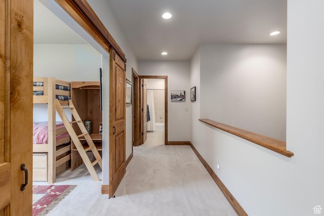 1085 W Links Dr, Midway, UT 84049 - hallway featuring light colored carpet, recessed lighting, and a barn door