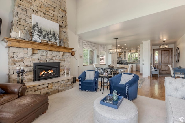 1085 W Links Dr, Midway, UT 84049 - living room with a fireplace, a chandelier, and wood finished floors