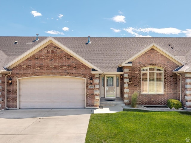 179 S 1060 E, American Fork, UT 84003 - view of front of house with brick siding, driveway, and a garage