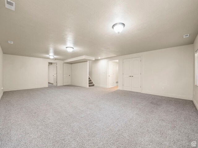 179 S 1060 E, American Fork, UT 84003 - finished below grade area featuring stairway, a textured ceiling, and carpet floors