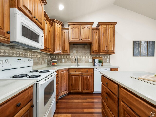 179 S 1060 E, American Fork, UT 84003 - kitchen with white appliances, light countertops, lofted ceiling, dark wood-style flooring, and decorative backsplash