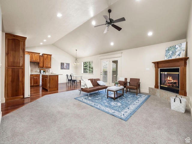 179 S 1060 E, American Fork, UT 84003 - living room with lofted ceiling, a glass covered fireplace, ceiling fan, recessed lighting, and dark carpet