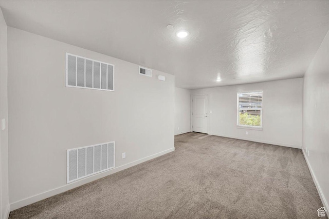 1167 E Telegraph St # A104, Washington, UT 84780 - carpeted spare room with baseboards and a textured ceiling