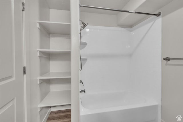 1167 E Telegraph St # A104, Washington, UT 84780 - bathroom featuring shower / bathtub combination and wood finished floors