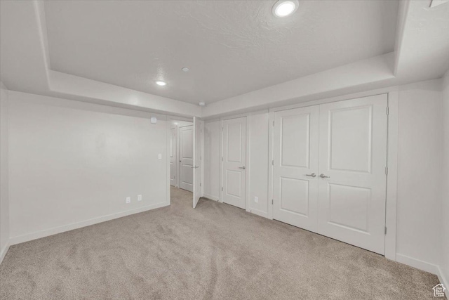 1167 E Telegraph St # A104, Washington, UT 84780 - unfurnished bedroom featuring carpet, multiple closets, and recessed lighting