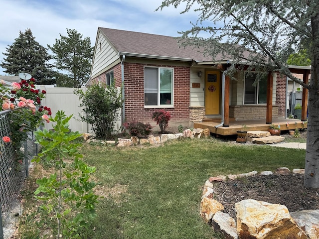1114 W Briarcliff Ave S, Salt Lake City, UT 84116 - view of front of property with brick siding, a porch, and roof with shingles