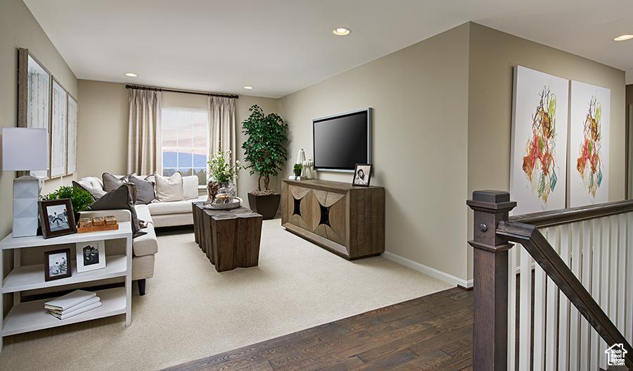 447 W Lefty Ln Unit 1119, Stansbury Park, UT 84074 - living room featuring dark wood-style floors and recessed lighting