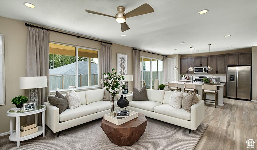 447 W Lefty Ln Unit 1119, Stansbury Park, UT 84074 - living area with a ceiling fan, light wood-style floors, and recessed lighting