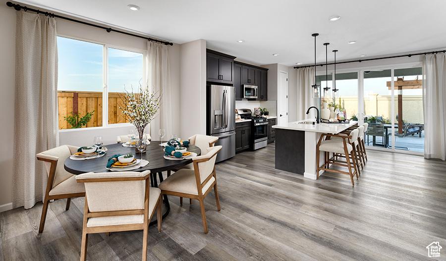 447 W Lefty Ln Unit 1119, Stansbury Park, UT 84074 - dining area with light wood-style flooring and recessed lighting