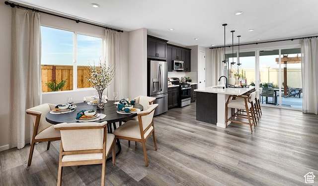 447 W Lefty Ln Unit 1119, Stansbury Park, UT 84074 - dining area with light wood-style flooring and recessed lighting