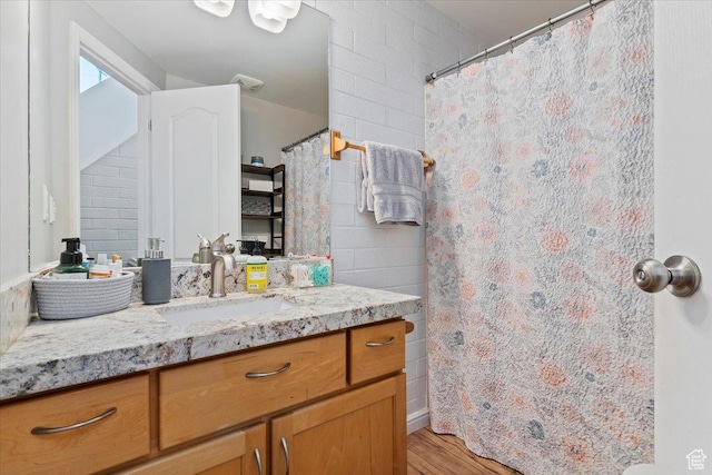 435 Aspen Dr Unit 8, Park City, UT 84098 - bathroom featuring vanity, wood finished floors, and curtained shower