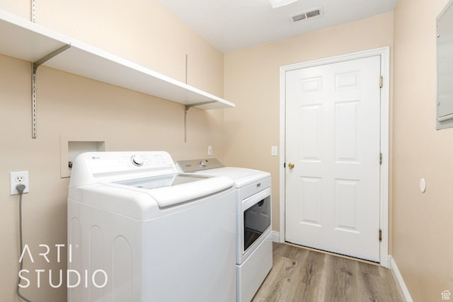 524 S Indian Hills Dr Unit 102, St George, UT 84770 - washroom featuring washing machine and dryer and light wood-type flooring