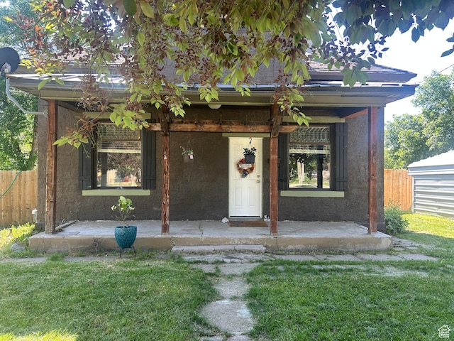 228 S 2 W, Preston, ID 83263 - view of front facade with stucco siding and a porch