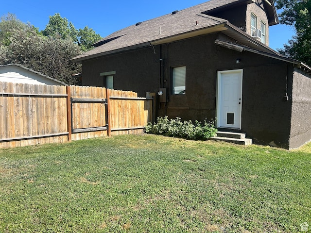 228 S 2 W, Preston, ID 83263 - rear view of property featuring entry steps, roof with shingles, and stucco siding