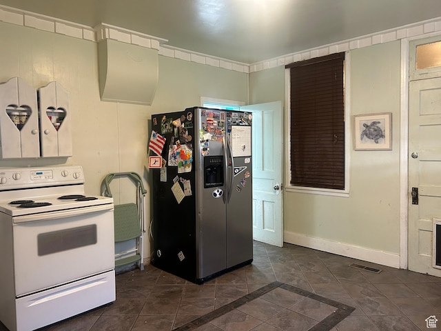228 S 2 W, Preston, ID 83263 - kitchen with white range with electric stovetop, stainless steel fridge with ice dispenser, and dark tile patterned floors