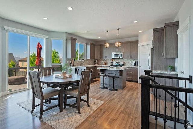 735 W Horizon Dr, Lehi, UT 84043 - dining space with light wood-style floors and recessed lighting