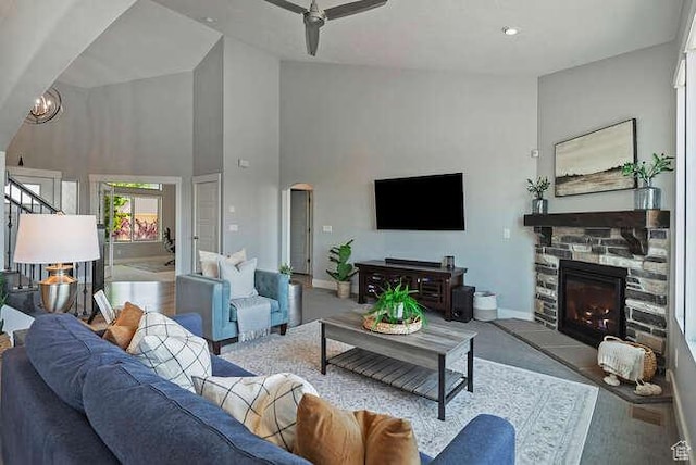 735 W Horizon Dr, Lehi, UT 84043 - living area featuring a towering ceiling, a fireplace, a ceiling fan, stairs, and arched walkways