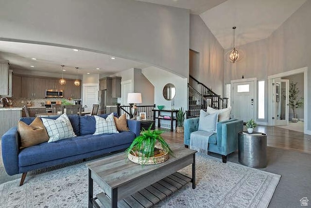 735 W Horizon Dr, Lehi, UT 84043 - living area with high vaulted ceiling, stairway, and recessed lighting