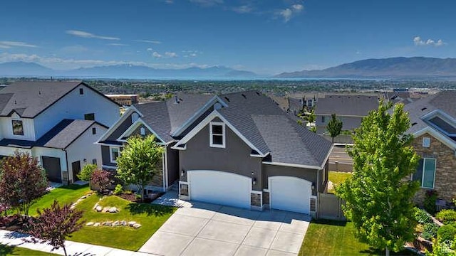 735 W Horizon Dr, Lehi, UT 84043 - view of front of property featuring driveway, stucco siding, a mountain view, a garage, and a residential view